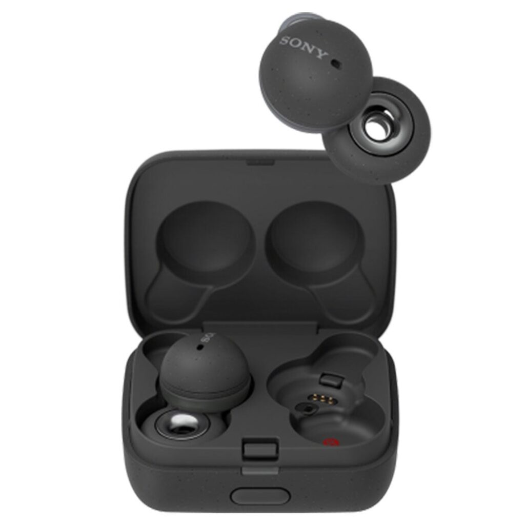 A Sony Link bud just above the small charging case. The buds are in black and look like a berry attached to a small donut. The donut sits over your ear canal when wearing.